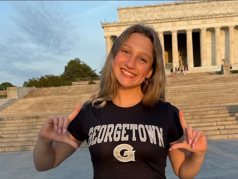 Acely student in a Georgetown shirt at the Lincoln Memorial