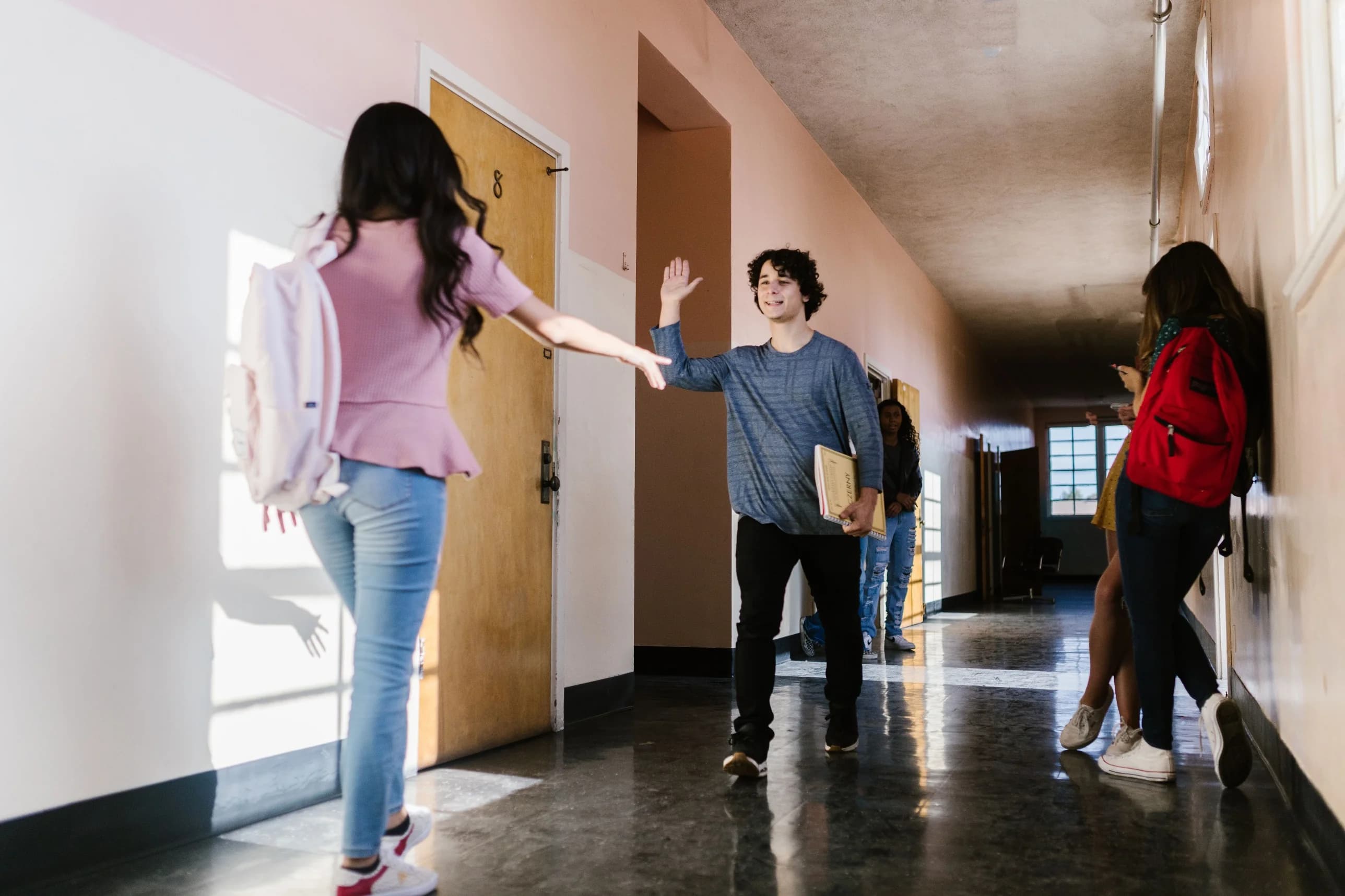 Students talking together outdoors on campus