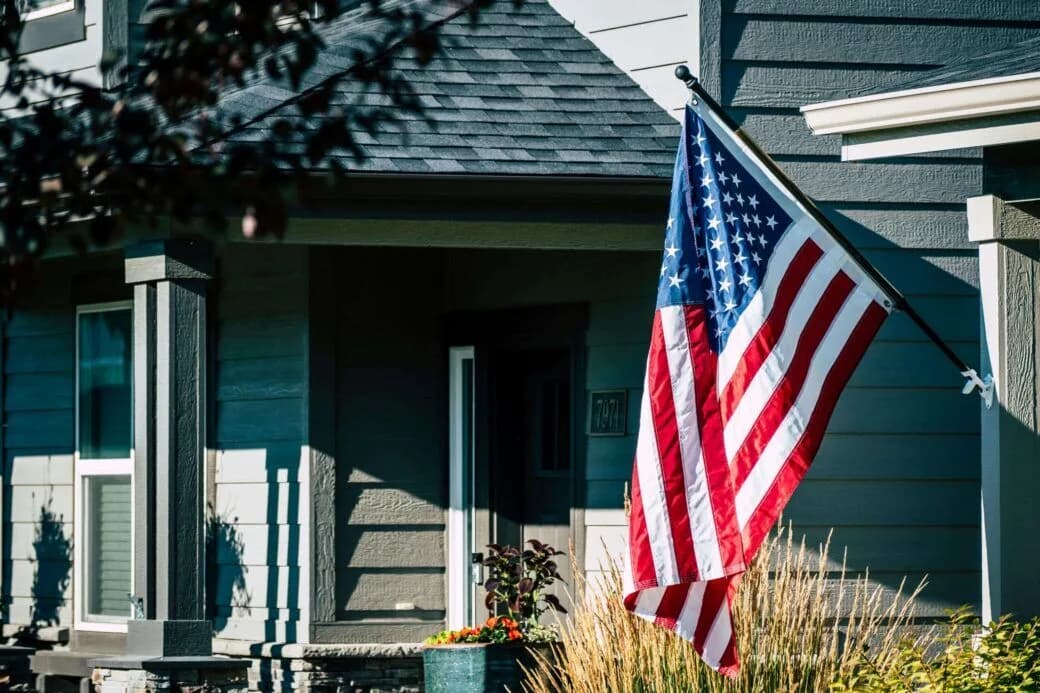 American flag on a front porch representing US History