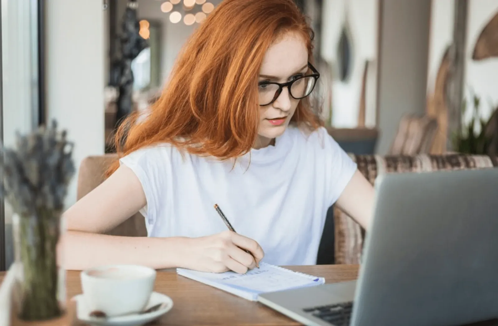 woman with glasses at computer