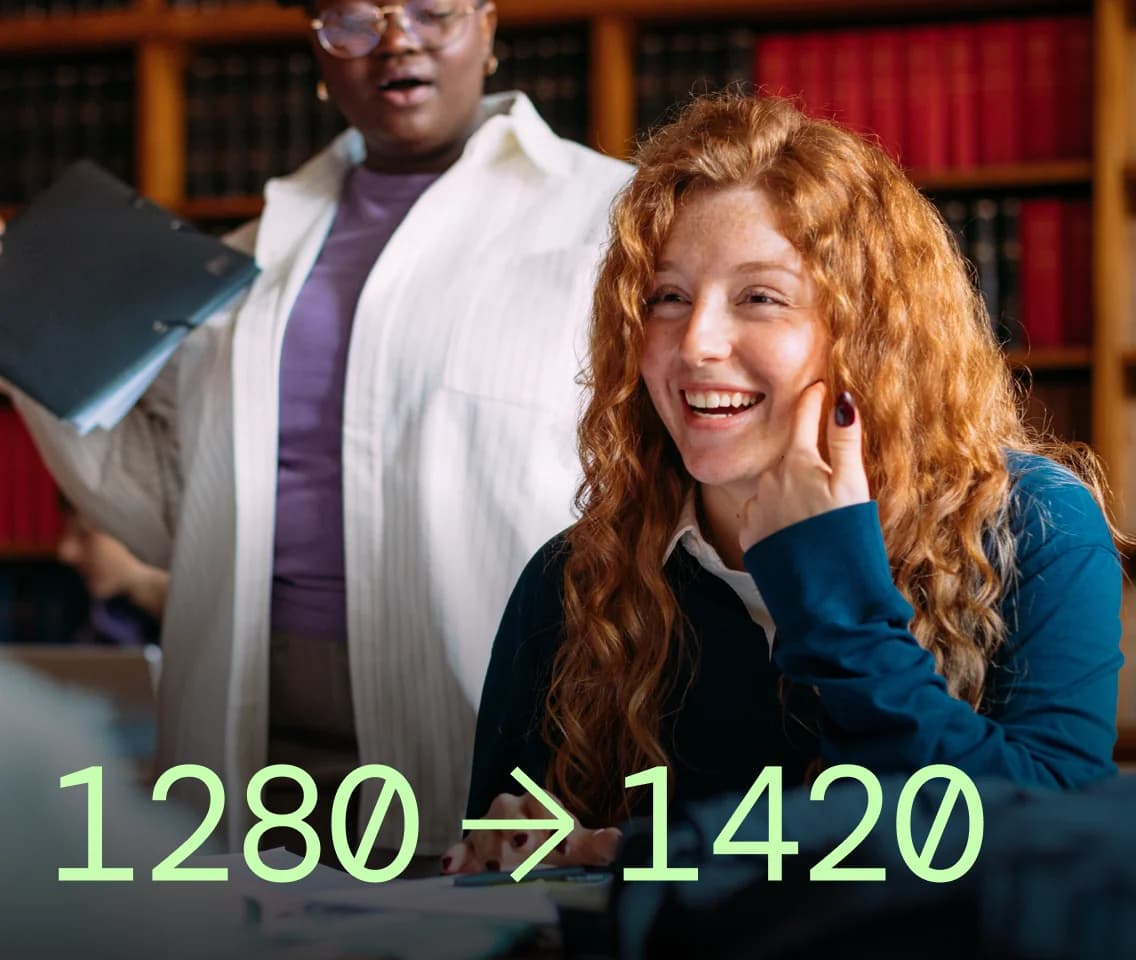 Two students celebrating an SAT score jump from 1280 to 1420