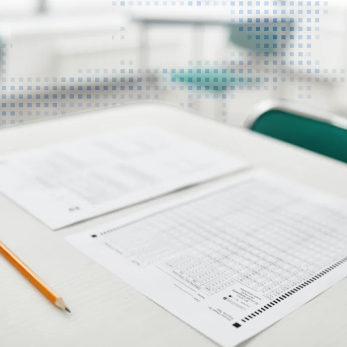 A test form with a pencil on a desk — SAT & ACT practice test dress rehearsal strategy