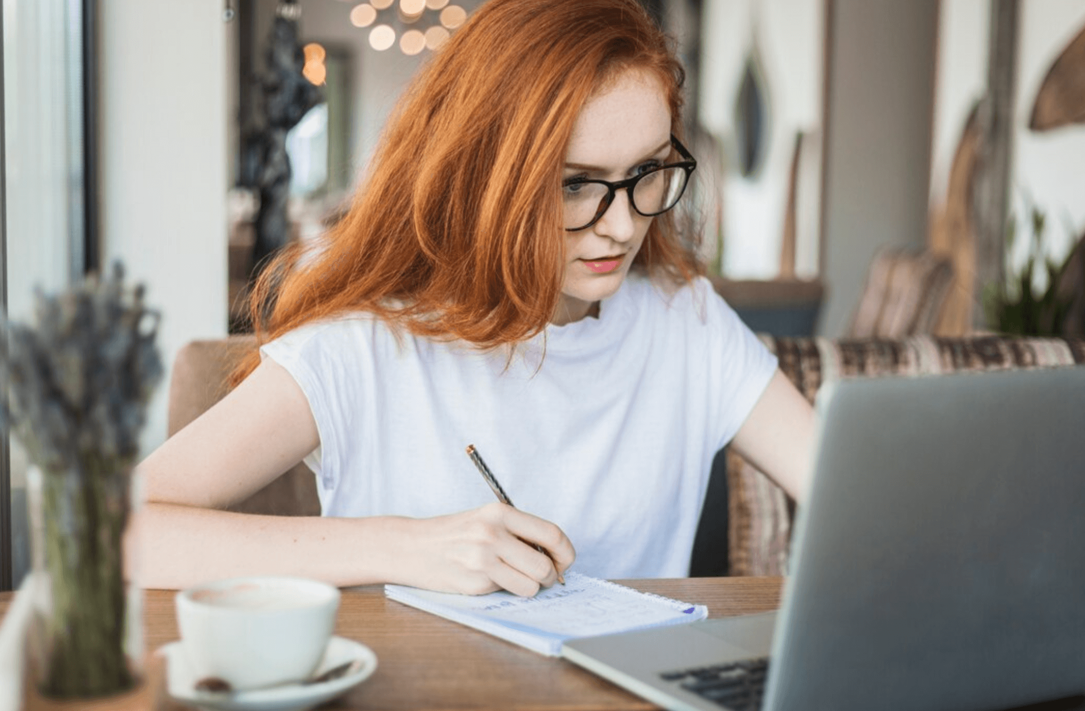 woman with glasses at computer